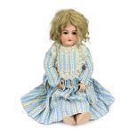 A Simon & Halbig bisque doll, German, circa 1892, impressed 1079 11½, with open mouth and moulded