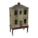 'Dunster House': A back-opening furnished dolls’ house, mid 19th century, set on its original