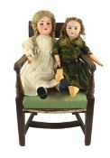 A Felix Arena bisque doll, German, circa 1920, impressed Mignon 0¼, with open mouth and upper teeth,