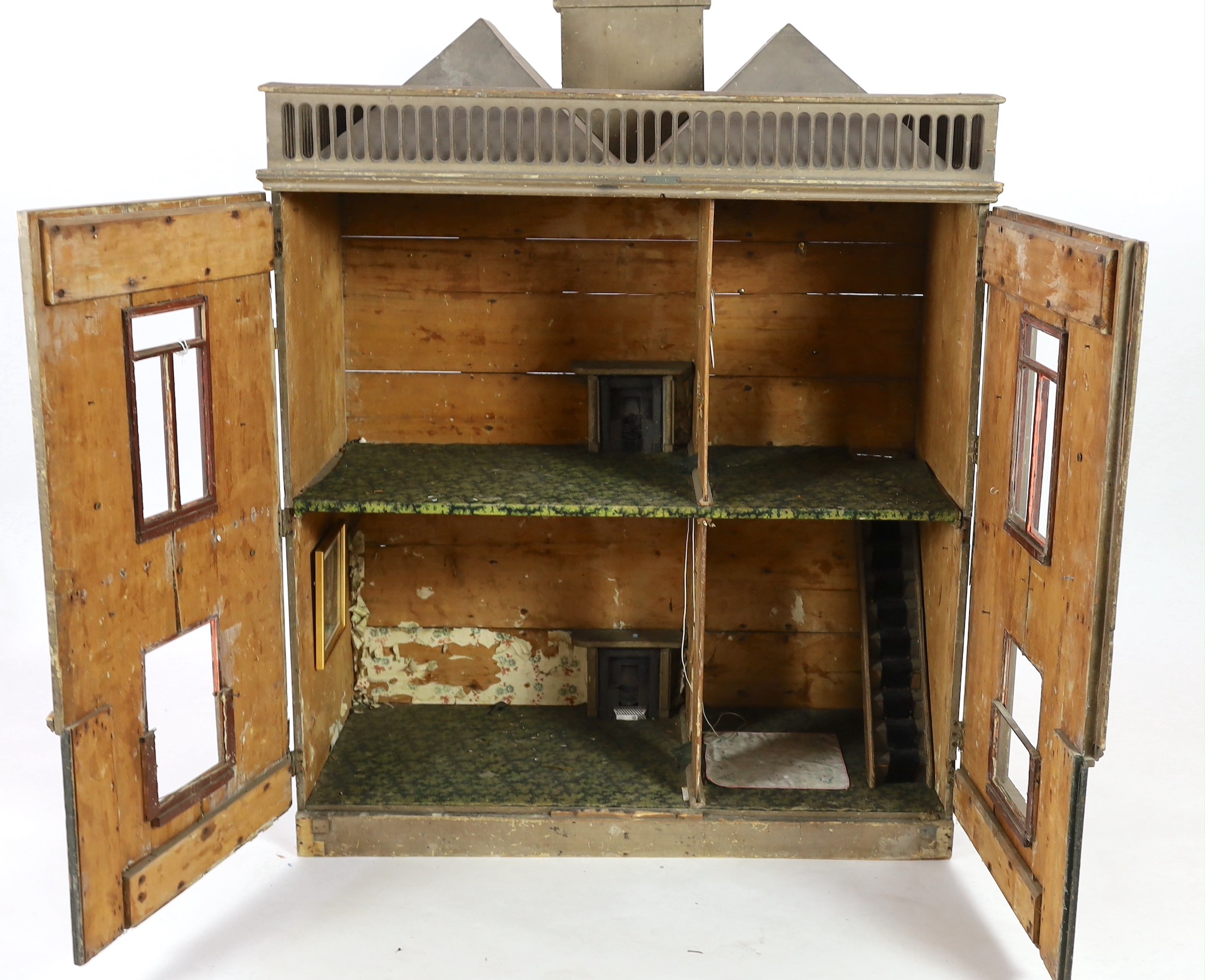 A very large English dolls’ house, circa 1840-1850, with a central panelled door and large windows - Image 8 of 10