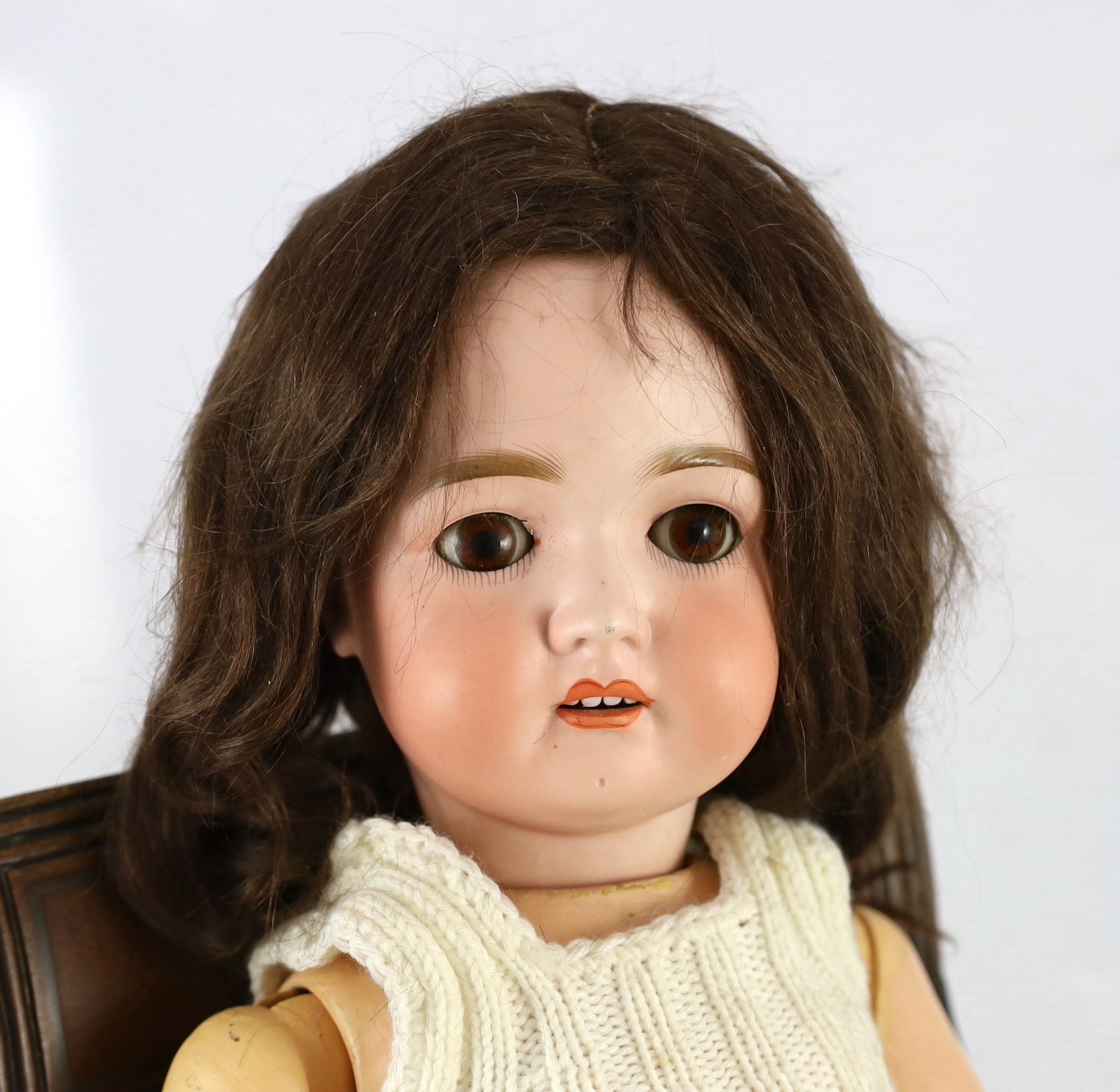 A bisque doll, German, circa 1900, impressed 70, with open mouth and upper teeth, weighted brown - Image 2 of 2