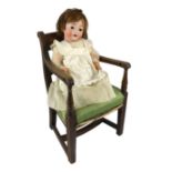 A Kohl and Wengenroth bisque character doll, German, circa 1910, impressed KW in an oval /12, with