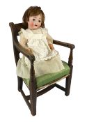 A Kohl and Wengenroth bisque character doll, German, circa 1910, impressed KW in an oval /12, with