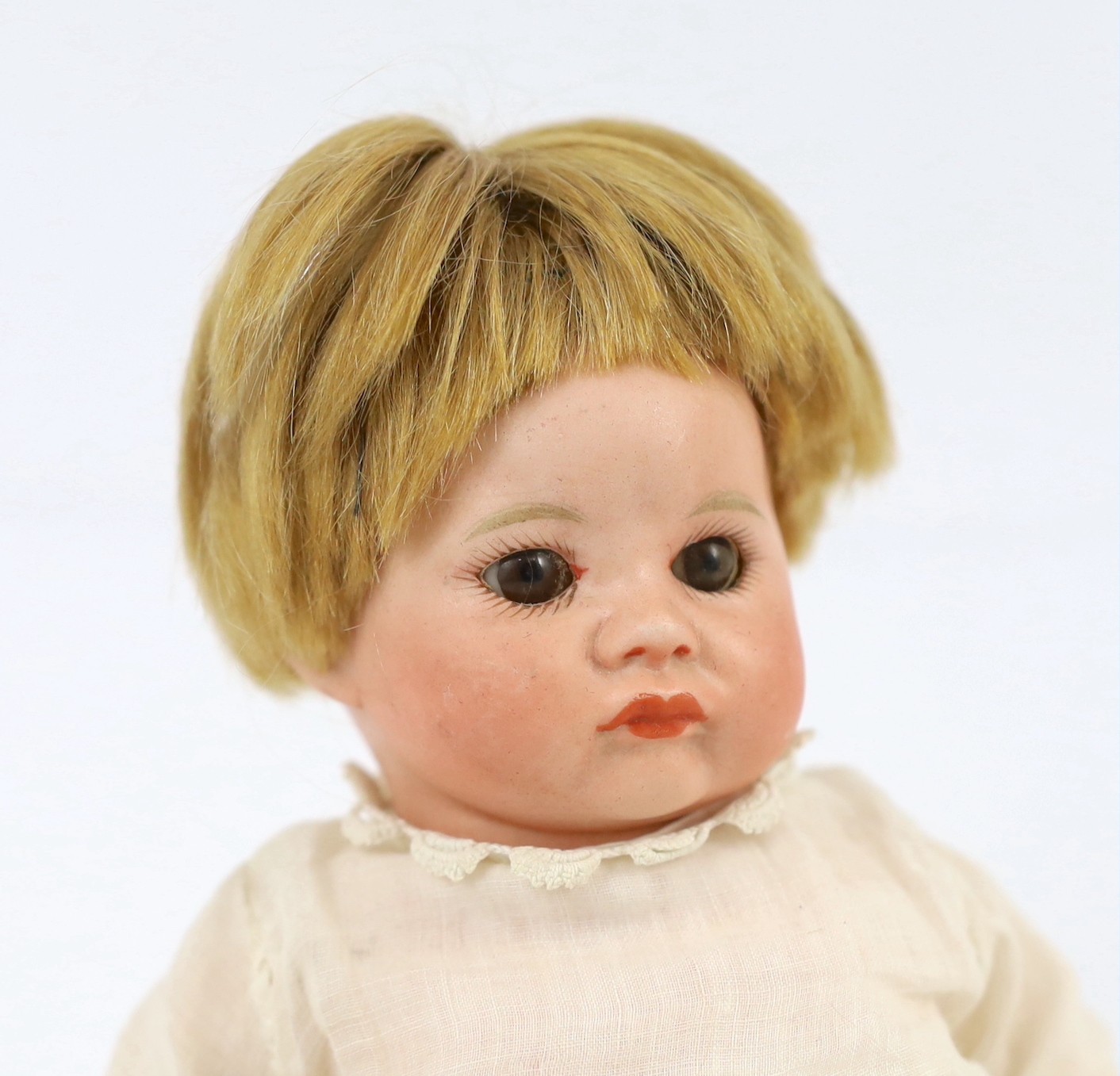 An SFBJ bisque character doll, French, circa 1925, impressed SFBJ 252, with closed pouty mouth, - Image 2 of 3