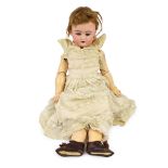 A bisque headed doll, probably by Kammer & Reinhardt, German, circa 1890, impressed 192, with open