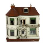 A G. and J. Lines furnished dolls’ house of 'Kits Koty' type, early 20th century, modelled as a