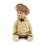 A bisque doll, German, circa 1914, impressed 2, with open mouth and upper teeth, weighted blue glass