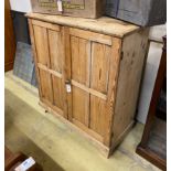 A Victorian pale pine two door side cabinet, width 95cm, depth 44cm, height 107cm