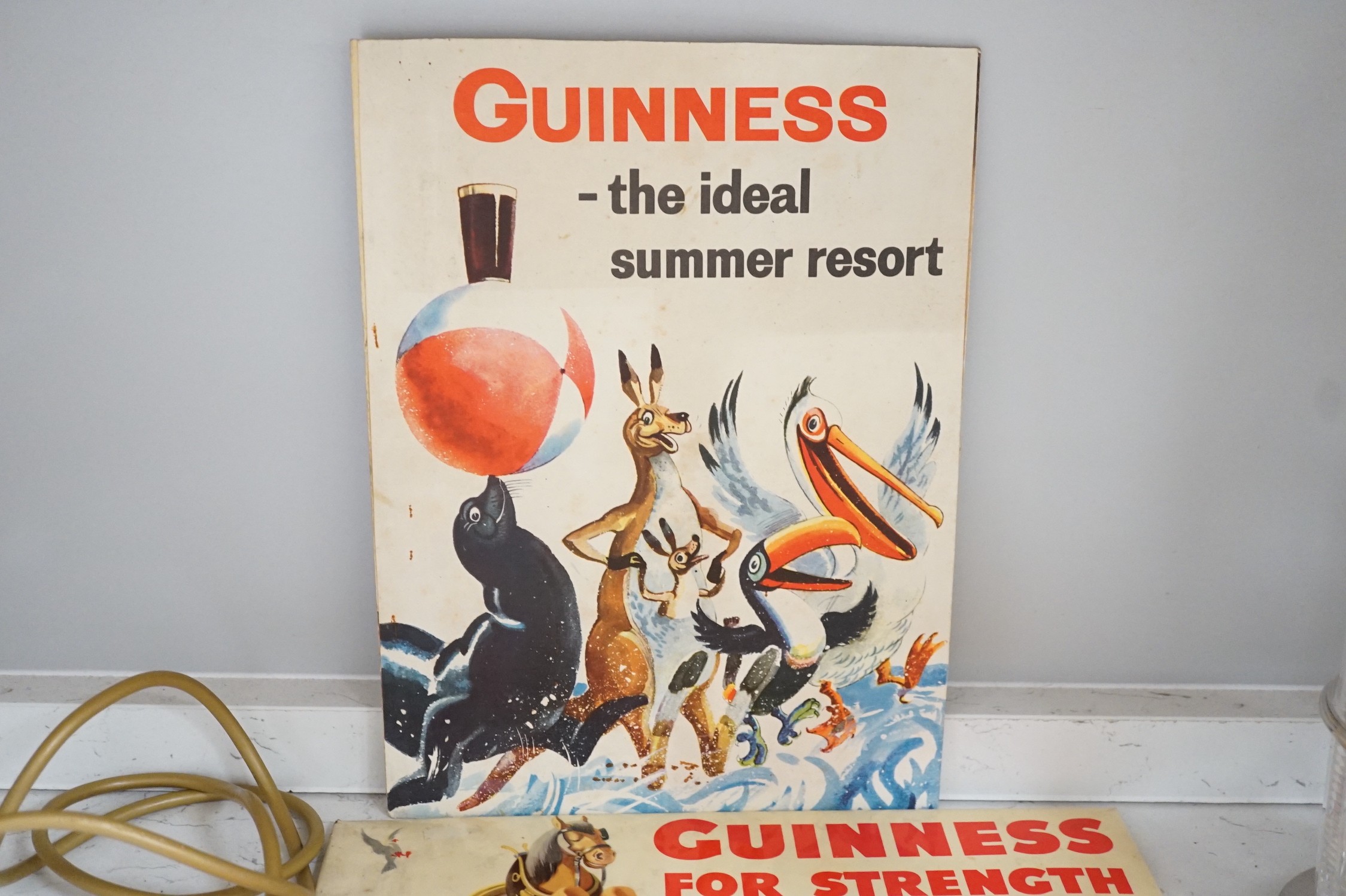 Five Guinness advertising signs, mirror, trays and a book - St. James’s Gate Brewery History and - Image 3 of 5