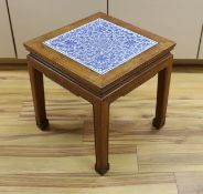 A Chinese hardwood and blue and white porcelain inset table, 42cm square