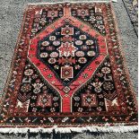 A Caucasian blue ground rug, 160 x 112cm