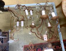A wrought iron four branch ceiling light, hung oval glass drops, height 56cm together with a pair of