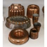 A copper jelly mould and other various copper moulds or cups