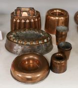 A copper jelly mould and other various copper moulds or cups
