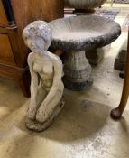 A circular reconstituted stone bird bath, diameter 48cm, height 42cm, together with a