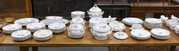An extensive early 20th century Belgian floral painted earthenware dinner service