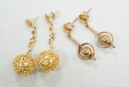 A modern pair of pierced 9ct gold globe drop earrings, 47mm and one other pair of 9ct drop earrings,