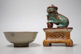 A 19th century Chinese Shiwan figure of a lion-dog and celadon glazed shallow bowl. Tallest 14cm