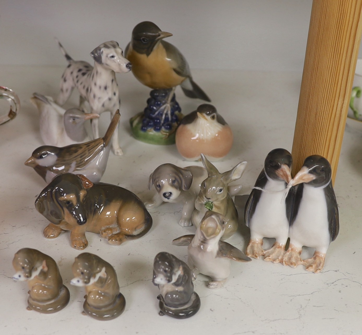 Thirteen Royal Copenhagen and similar model birds and animals. Tallest 14cm