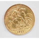 A George V 1911 gold half sovereign, with leather purse.