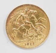 A George V 1911 gold half sovereign, with leather purse.