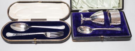 A cased George V silver christening trio, by Walker & Hall, Sheffield, 1925 and a cased silver