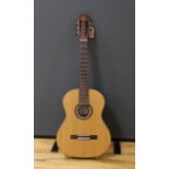 An Admira 'Concerto' classical guitar. Cedar top, satin finish with rosewood back and sides