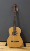 An Admira 'Concerto' classical guitar. Cedar top, satin finish with rosewood back and sides