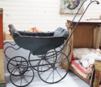 A late 19th century dolls’ pram, circa 1880, 75cms high x 90cms long on a wrought iron chassis