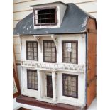 An early 20th century Lines Bros doll’s house, 81cms high x 64cms wide