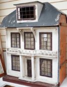 An early 20th century Lines Bros doll’s house, 81cms high x 64cms wide