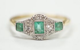 A 1920's 18ct & plat, millegrain set three stone emerald and four stone diamond ring, size R/S,