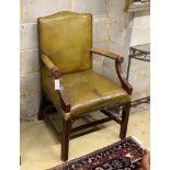 A George III style mahogany green leather library armchair, width 66cm, depth 64cm, height 99cm