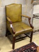 A George III style mahogany green leather library armchair, width 66cm, depth 64cm, height 99cm