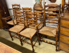 A set of eight reproduction elm and beech rush seat ladder back dining chairs, two with arms