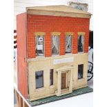 ‘Heiress House’: A commercially made London ‘boxback’ dolls’ house, late 19th century, 56cms wide