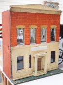 ‘Heiress House’: A commercially made London ‘boxback’ dolls’ house, late 19th century, 56cms wide