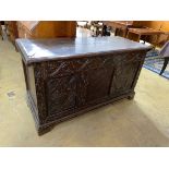 An 18th century and later carved oak coffer, with zinc liner, width 136cm, depth 56cm, height 76cm