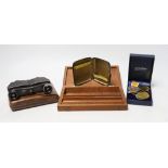 A pair of military binoculars, box of WWI and other medals, a silver card case and artist's box