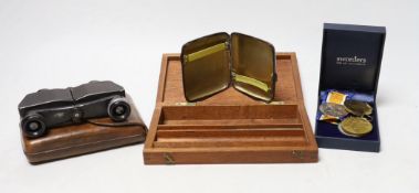 A pair of military binoculars, box of WWI and other medals, a silver card case and artist's box