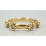 A modern 18ct gold and four stone diamond set ring, size K, gross weight 4 grams.