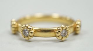 A modern 18ct gold and four stone diamond set ring, size K, gross weight 4 grams.