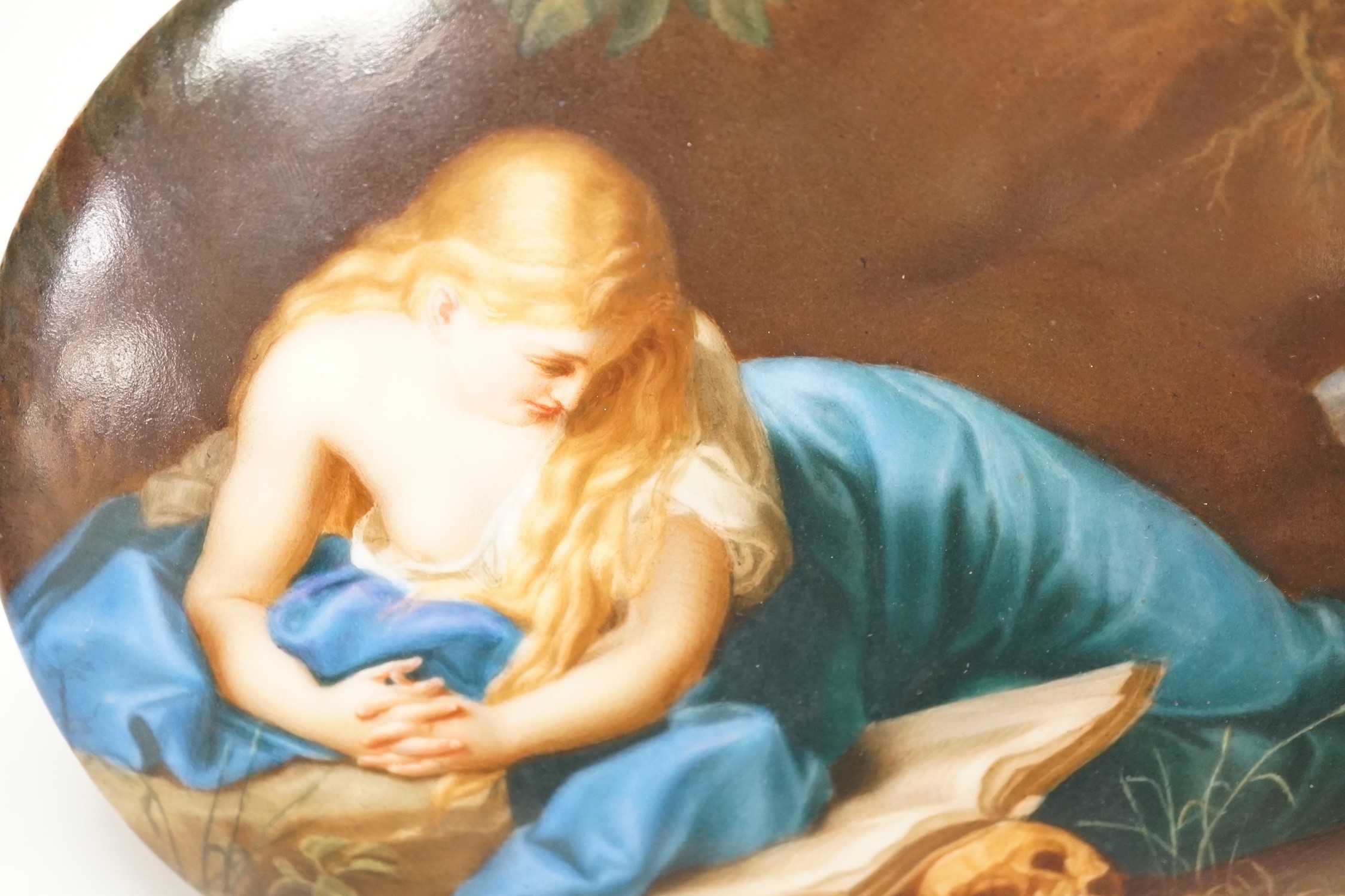 A 19th century painted porcelain oval plaque of a reclining lady reading a book. The reverse stamped - Image 2 of 4