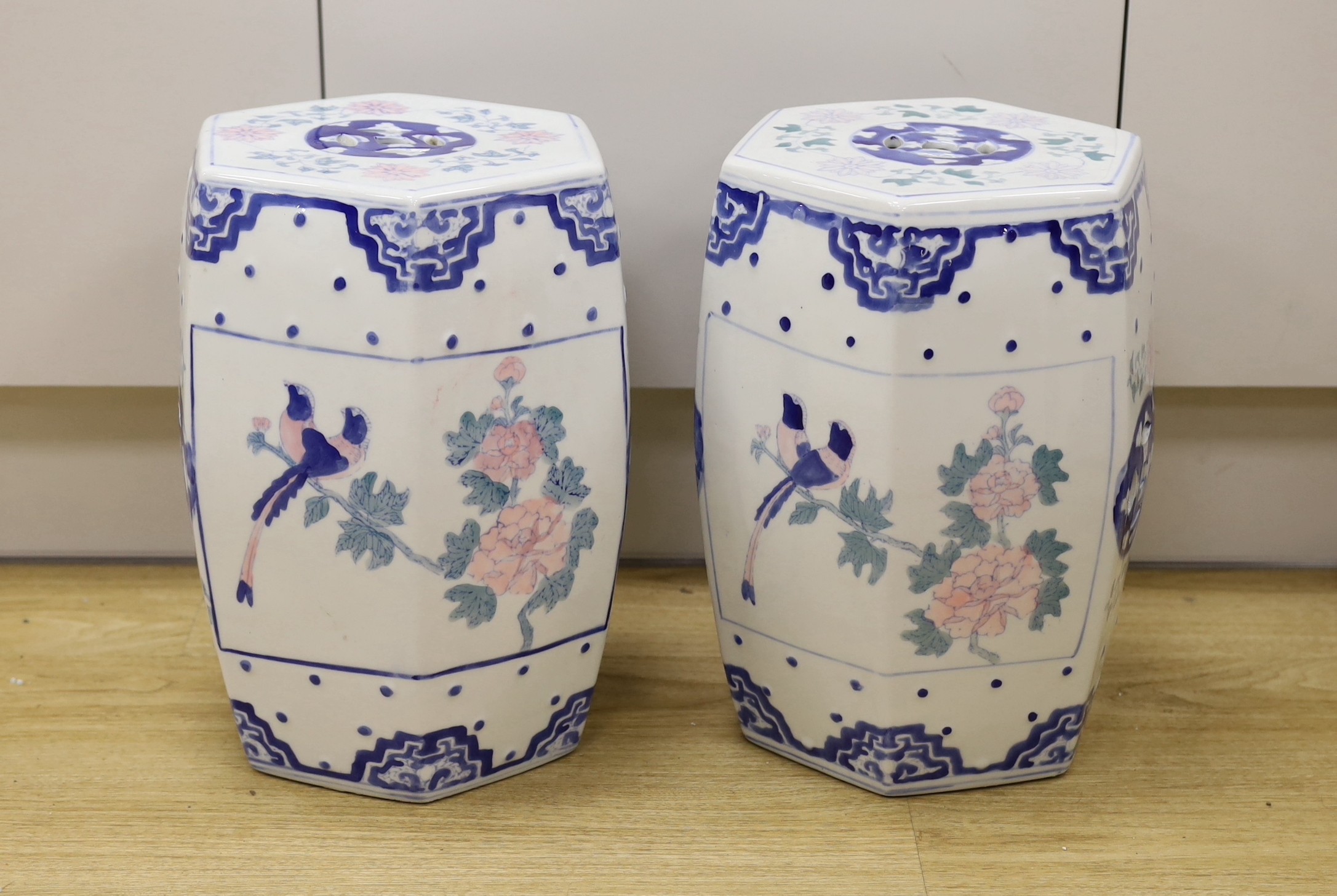 A pair of Chinese porcelain decorative garden seats, 37cms high