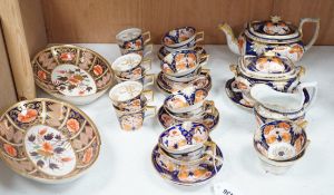 An early 19th century English porcelain Japan-pattern tea and coffee set and two similar dessert