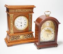A Garrard clock and an oak brass mounted clock 29cms high,