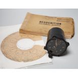 A WWII Air Ministry altimeter model XIV B and a War & Navy Department aircraft recognition pictorial
