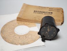 A WWII Air Ministry altimeter model XIV B and a War & Navy Department aircraft recognition pictorial