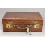 A George V crocodile skin toilet case