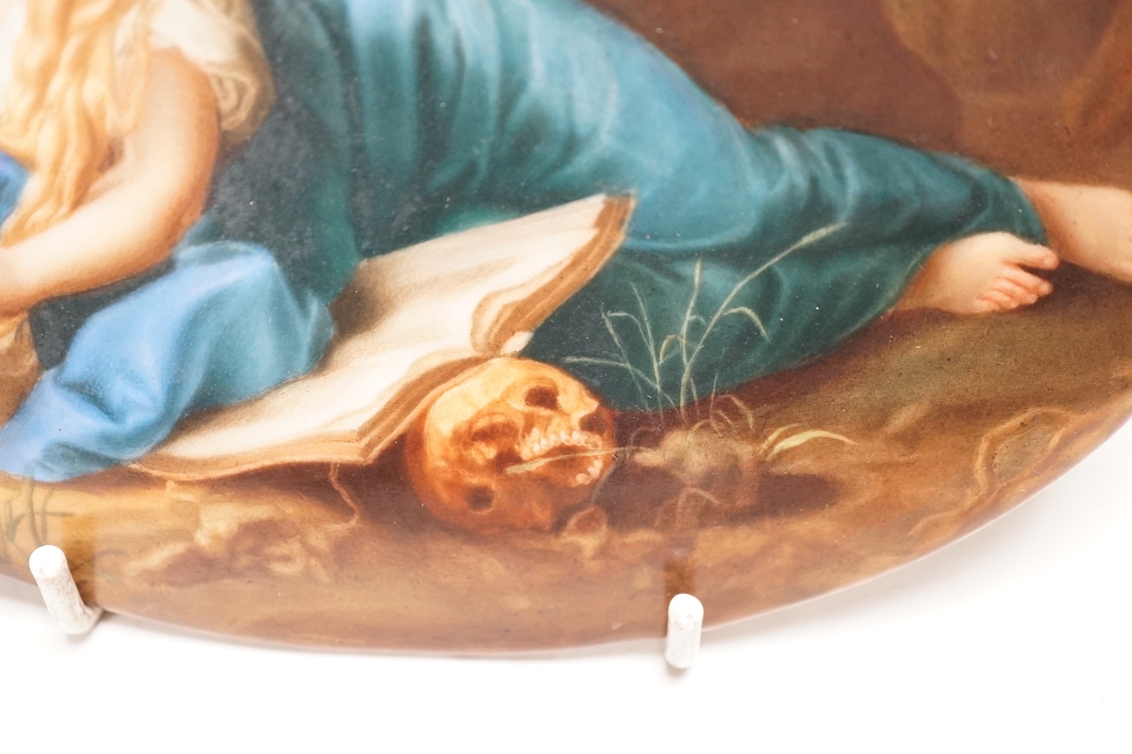 A 19th century painted porcelain oval plaque of a reclining lady reading a book. The reverse stamped - Image 3 of 4